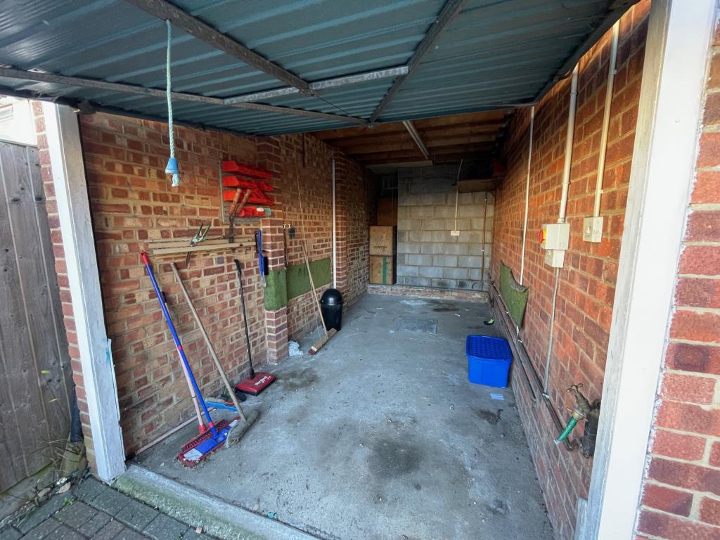 Lot: 118 - THREE-BEDROOM HOUSE FOR IMPROVEMENT - Garage with up and over door